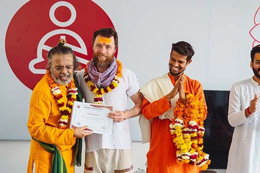 Niall Phelan, student of Nirvana Yoga School receiving his 500 hour Yoga Teacher Training certification	